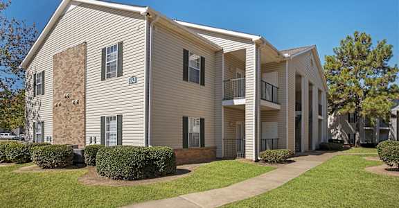 A residential building with a boarded up window at Grand at Pearl Apartments, Mississippi, 39208