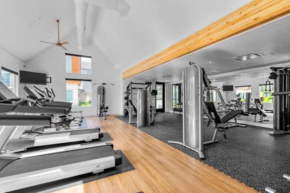 the gym is equipped with treadmills and other fitness equipment