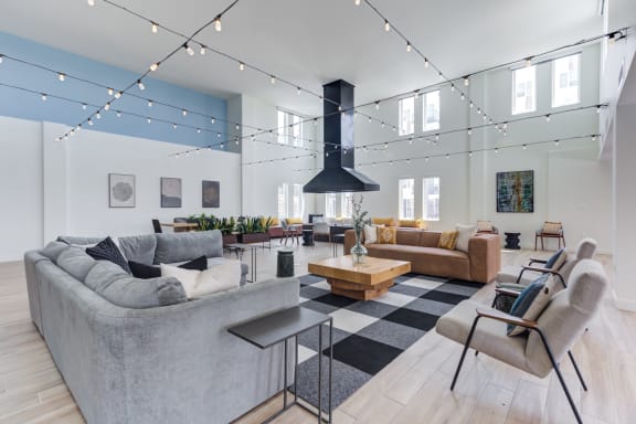 a living room filled with furniture and a large fireplace