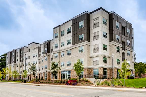 Exterior of Townes at Clarkston Centre apartments in Clarkston, GA, offering pet-friendly 1, 2 and 3 bedroom apartment homes.
