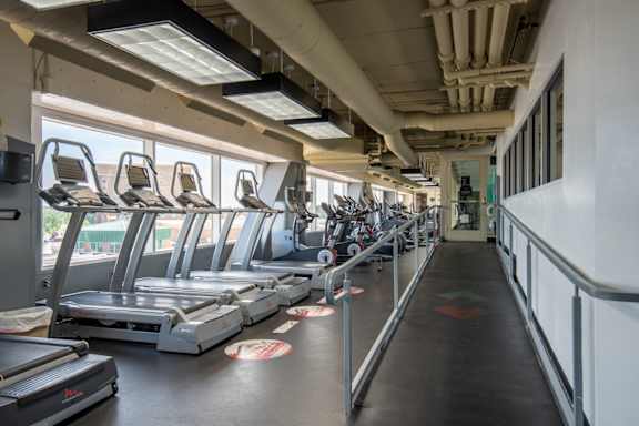a row of cardio machines in a gym at The Lucy Boise Apartments, Boise, ID