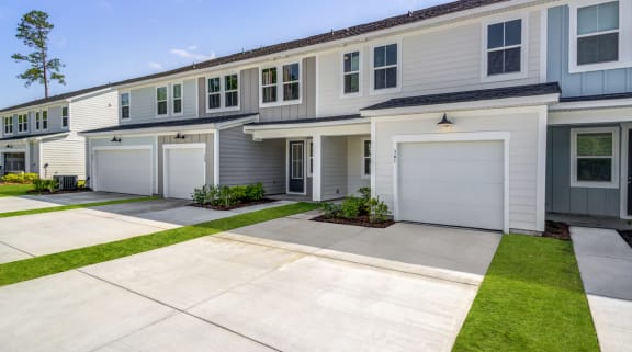 garage door with flowering bush