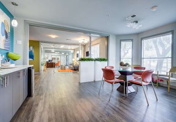 A modern kitchen with a dining table and chairs.at Metro 5514, Houston, 77021