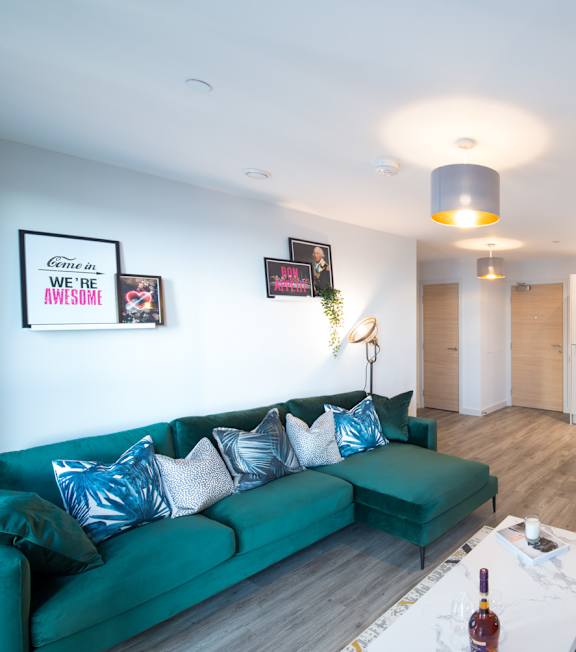 A modern house with a grey front and a green door at The Foundry Apartments, Bordon
