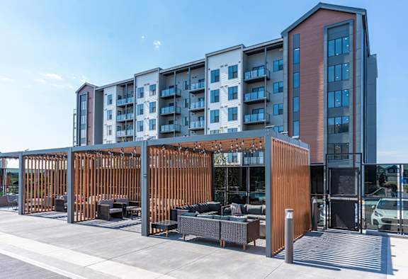 A modern building with a wooden fence in front.
