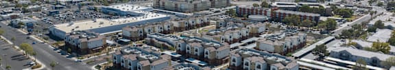 Apartment complex with a pool and playground.