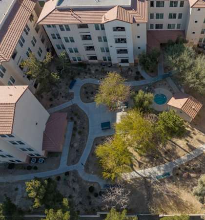 A bird's eye view of a courtyard surrounded by buildings.