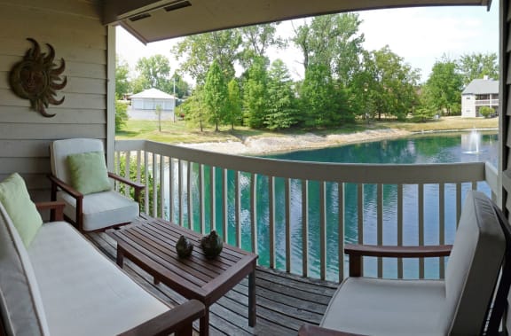 Balcony with a view of a lake and a deck with chairs at Normandy Club, Centerville, 45459