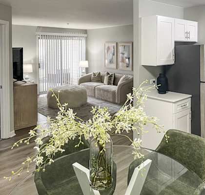 A modern kitchen with a glass table at Evergreen Luxury Apartments, Merrillville, Indiana