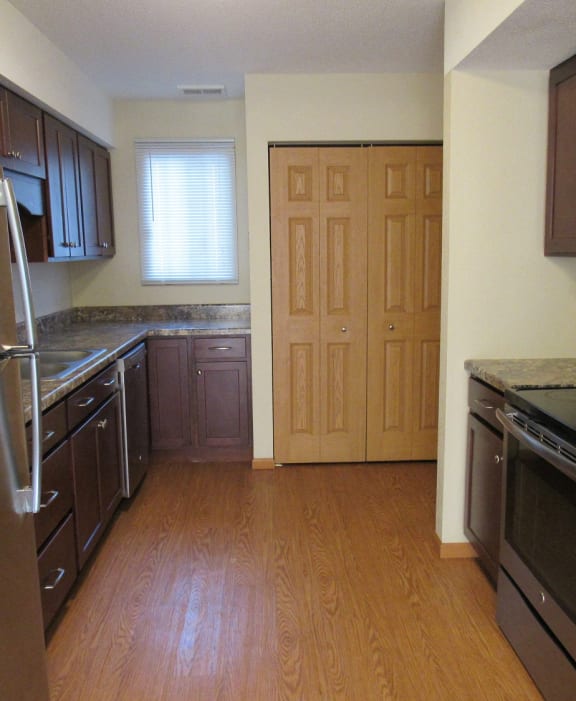 a kitchen with a stove and a microwave