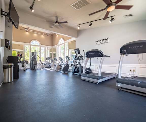 The gym with treadmills and other exercise equipment at the Brookwood Village Apartment Homes. 