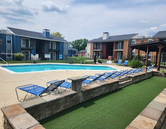 our apartments have a large swimming pool with chaise lounge chairs