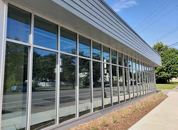 the side of a building with glass windows