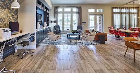 A modern living room with a wooden floor and furniture.