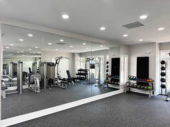 Fitness center with virtual training and barre bar