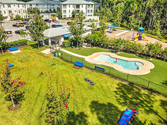Pavilion with outdoor pool table overlooking the pool