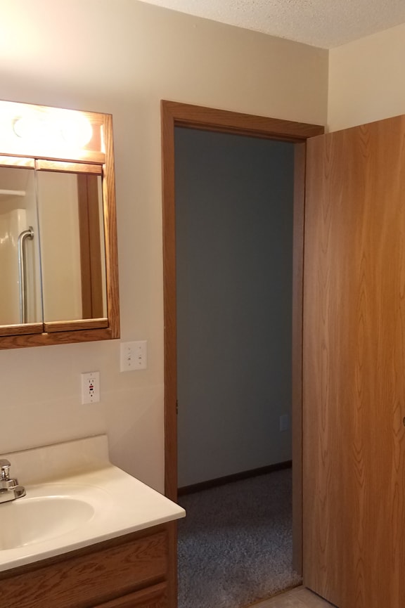 a bathroom with a toilet and a sink and a bath tub