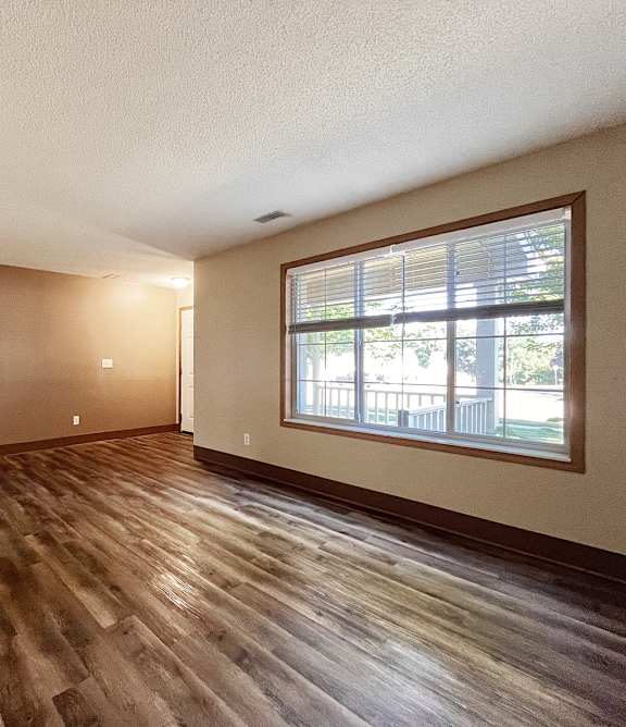 a living room with a couch and a chair and a table