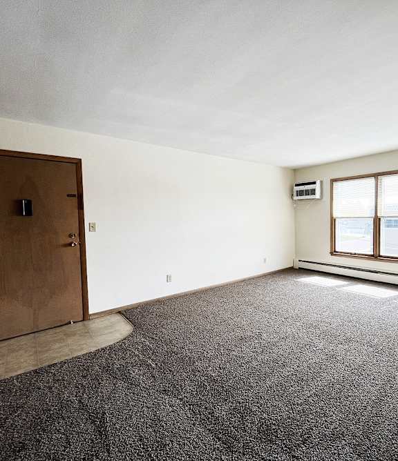 a living room with a couch and a chair and a table