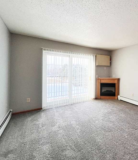 a living room with a couch and a chair and a table