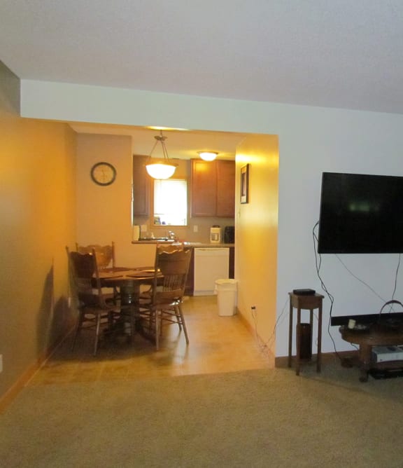 a living room with a couch and a chair and a table