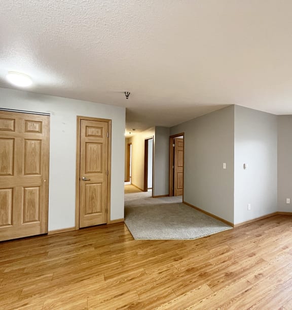 a bedroom with a bed and a ceiling fan