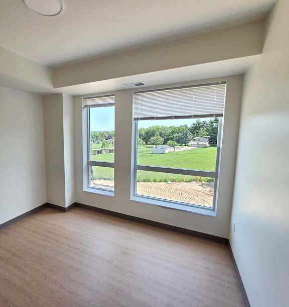 a bedroom with a bed and a ceiling fan