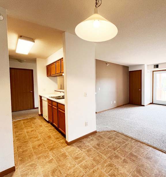 a bedroom with a bed and a ceiling fan