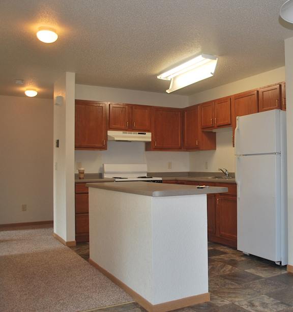 a bedroom with a bed and a ceiling fan