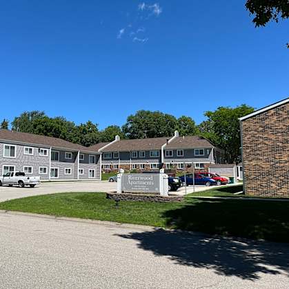 a street view of a building with a sign in front of it