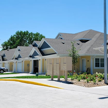 A row of houses with a yellow line in front of them.