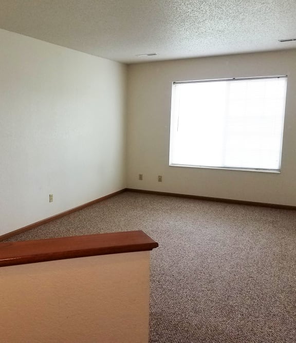 a living room with a couch and a chair and a table