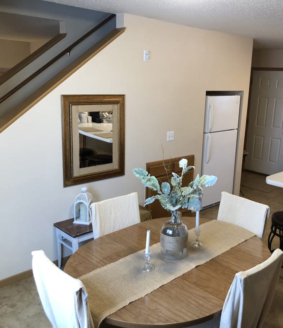a living room with a couch and a chair and a table