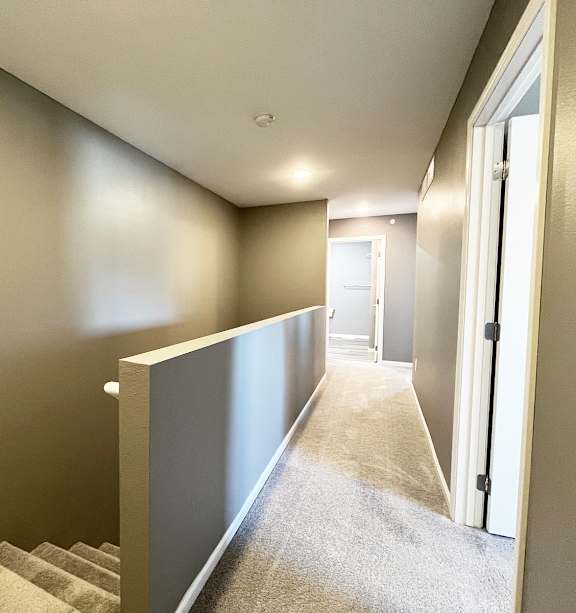 a bedroom with a bed and a ceiling fan