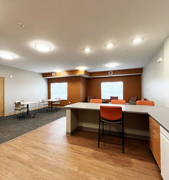 a bedroom with a bed and a ceiling fan