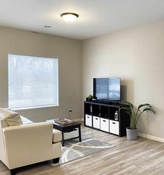 a bedroom with a bed and a ceiling fan