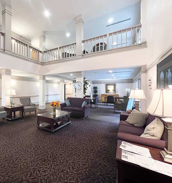a bedroom with a bed and a ceiling fan