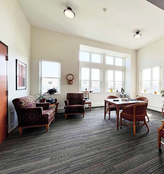 a bedroom with a bed and a ceiling fan