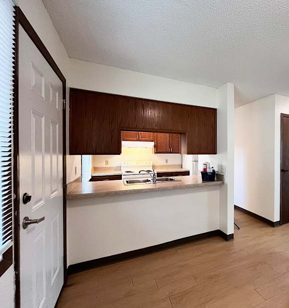 a bedroom with a bed and a ceiling fan