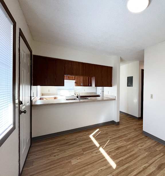 a bedroom with a bed and a ceiling fan