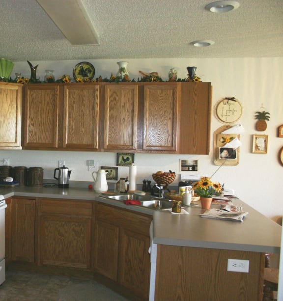 a bedroom with a bed and a ceiling fan