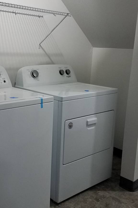 a bathroom with a toilet and a sink and a bath tub