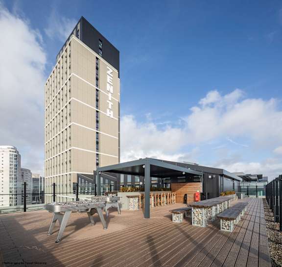 A modern building with the word "ZEITH" on it.