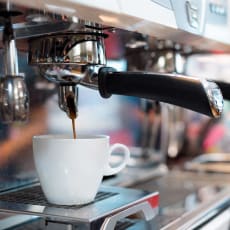 a espresso machine brewing a cup of coffee