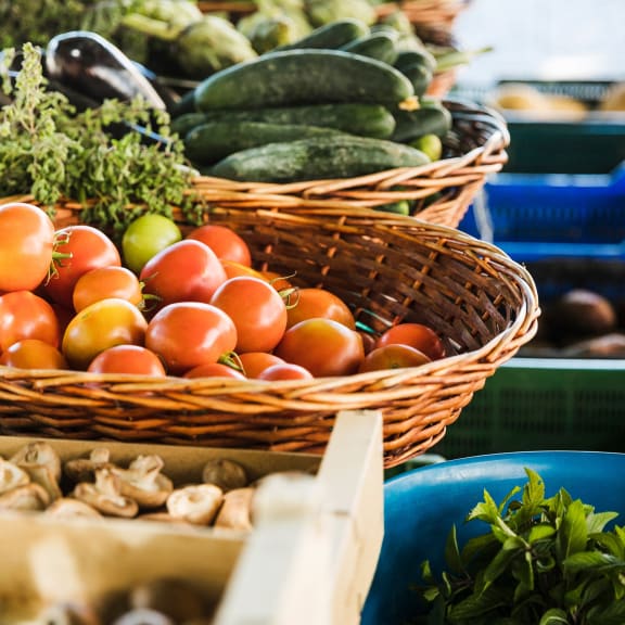 a variety of fruits and vegetables on display at a market