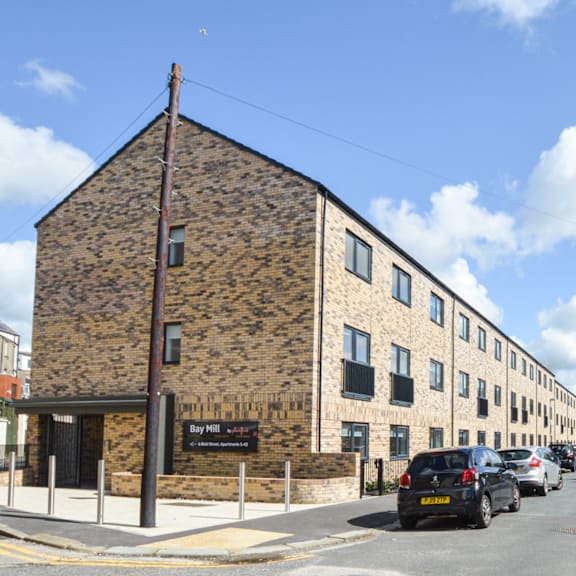 A brick building with a sign that says Bay Mills.