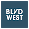 A sign with the words "BLVD WEST" on a green background.