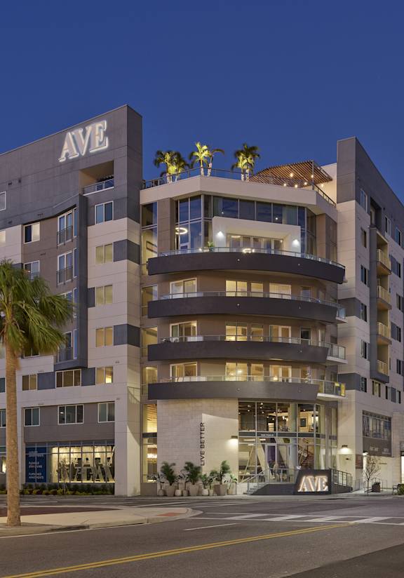 AVE Tampa Riverwalk building exterior at dusk
