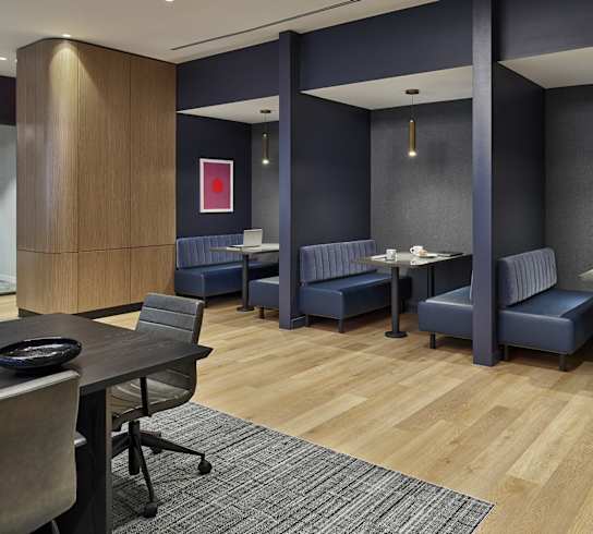 A conference room with a long table and chairs.