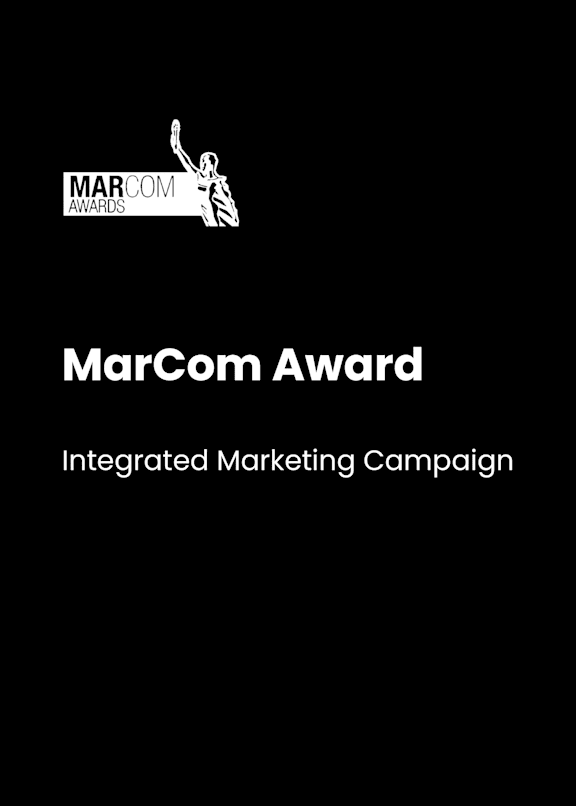 A black and white image of a trophy with the words MarCom Award on it.